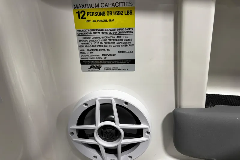 Slide: The Image of 2026 Chaparral 21 SSi boat capacity label, 12 persons or 1692 lbs, compliance details. - 32