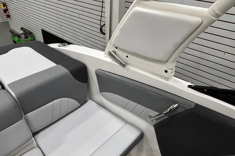 Slide: The Image of 2026 Chaparral 21 SSi boat interior with gray and white seating, modern design. - 35