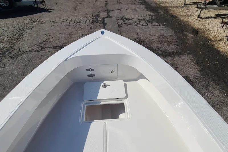 Slide: The Image of Bow view of 2025 Paramount 21 boat, featuring a clean, white deck design. - 10