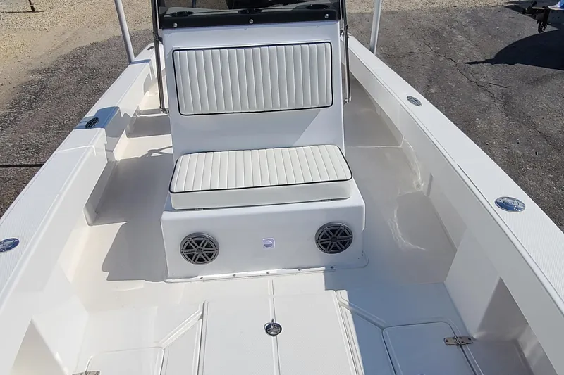 Slide: The Image of 2025 Paramount 21 boat interior with white seating and speakers. - 15