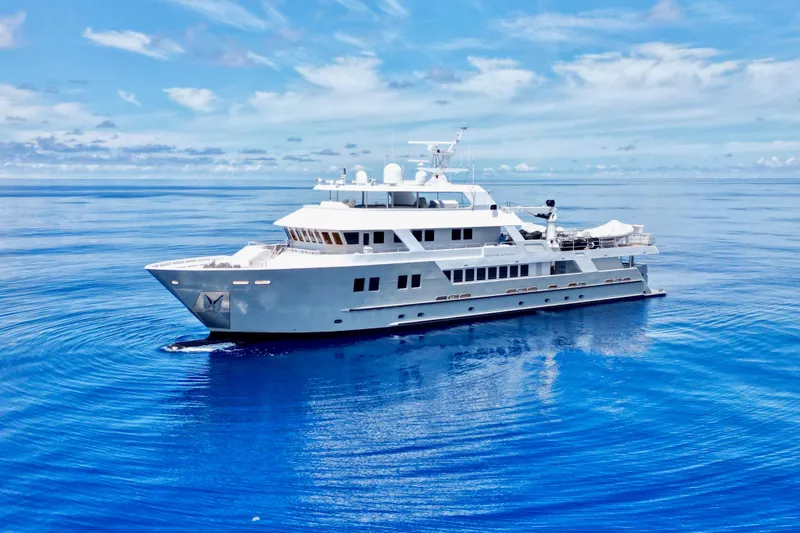The Image of Luxurious 2011 C & G Boatworks Explorer yacht cruising on calm blue ocean waters. - 0