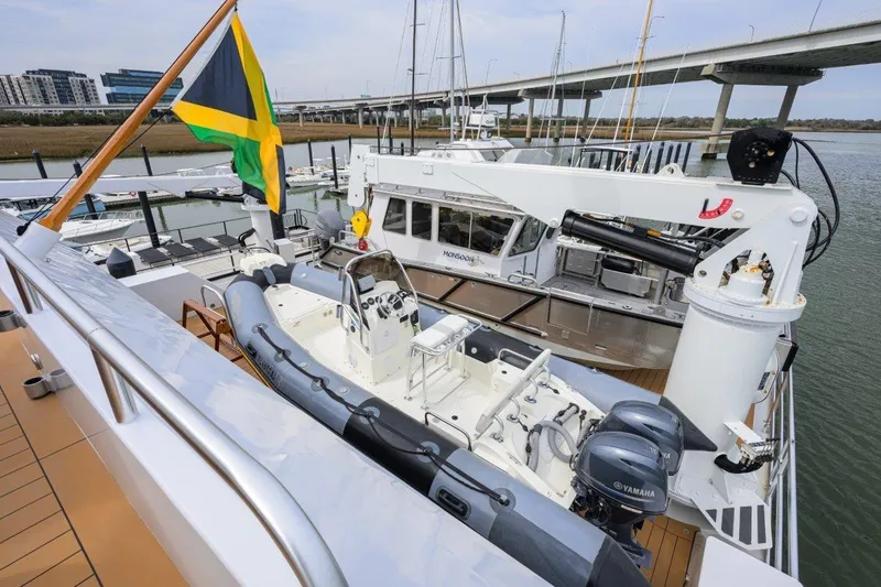 Slide: The Image of 2011 C & G Boatworks Explorer docked with Jamaican flag, featuring Yamaha engines. - 10