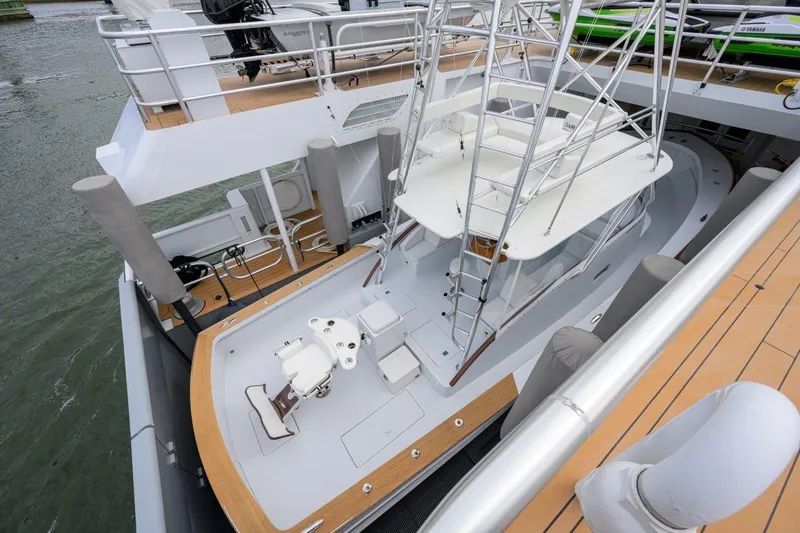 Slide: The Image of 2011 C & G Boatworks Explorer docked, featuring spacious deck and modern design. - 14