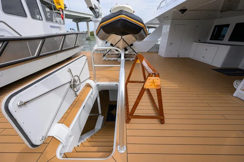 Slide: The Image of Deck of 2011 C & G Boatworks Explorer with open hatch and lifeboat. - 18