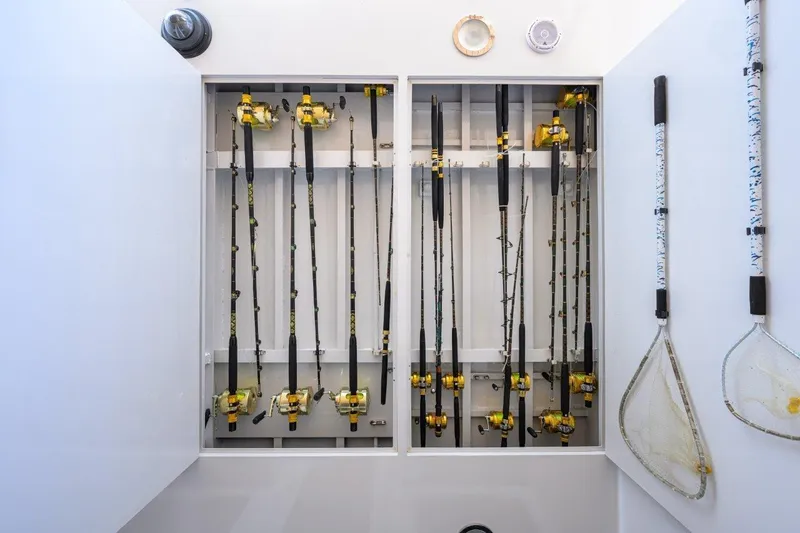 Slide: The Image of Fishing rods and nets stored on a 2011 C & G Boatworks Explorer. - 22