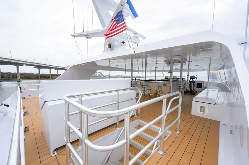 Slide: The Image of 2011 C & G Boatworks Explorer yacht deck with seating and exercise equipment. - 27