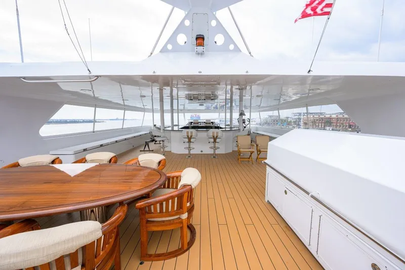 Slide: The Image of Luxurious 2011 C & G Boatworks Explorer yacht deck with seating and dining area. - 28