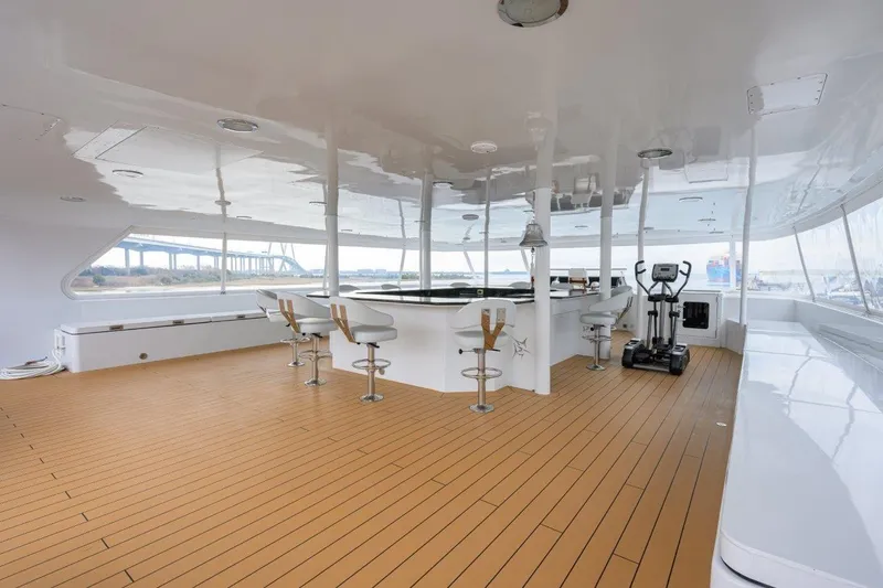Slide: The Image of Spacious deck of 2011 C & G Boatworks Explorer with bar and exercise equipment. - 32