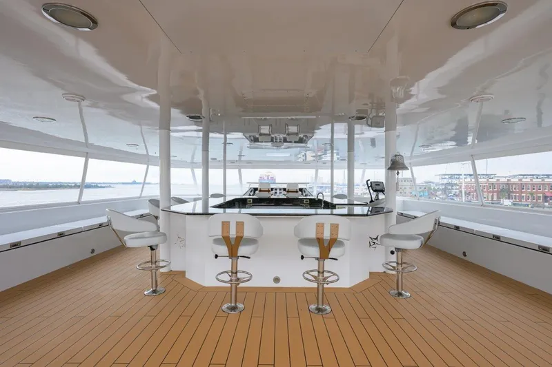 Slide: The Image of Luxurious 2011 C & G Boatworks Explorer yacht interior with bar and seating area. - 33