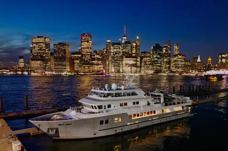 Slide: The Image of Luxury yacht docked at night with city skyline; 2011 C & G Boatworks Explorer. - 4