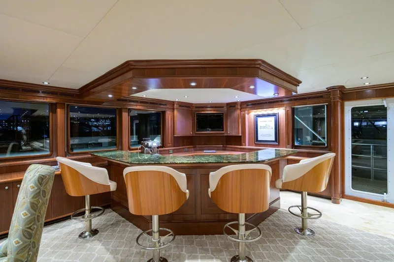 Slide: The Image of Luxurious yacht interior with wooden bar and swivel chairs, C & G Boatworks Explorer 2011. - 42
