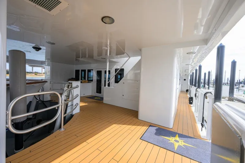Slide: The Image of Spacious deck of 2011 C & G Boatworks Explorer with wooden flooring and modern design. - 5