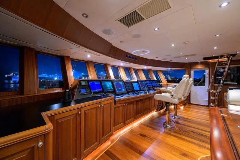 Slide: The Image of Luxurious 2011 C & G Boatworks Explorer yacht interior with wood paneling and advanced navigation systems. - 50