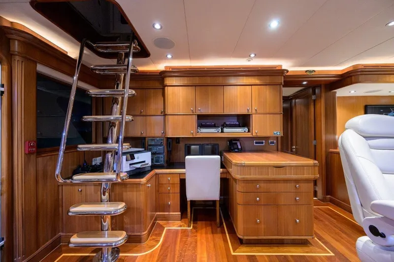 Slide: The Image of Luxurious 2011 C & G Boatworks Explorer yacht interior with wooden cabinetry and modern office setup. - 52