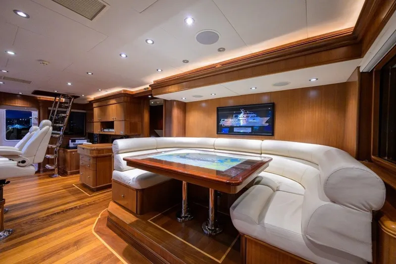 Slide: The Image of Luxurious 2011 C & G Boatworks Explorer yacht interior with elegant wood and leather seating. - 53