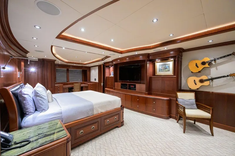 Slide: The Image of Luxurious 2011 C & G Boatworks Explorer bedroom with elegant wood finishes and mounted guitars. - 57