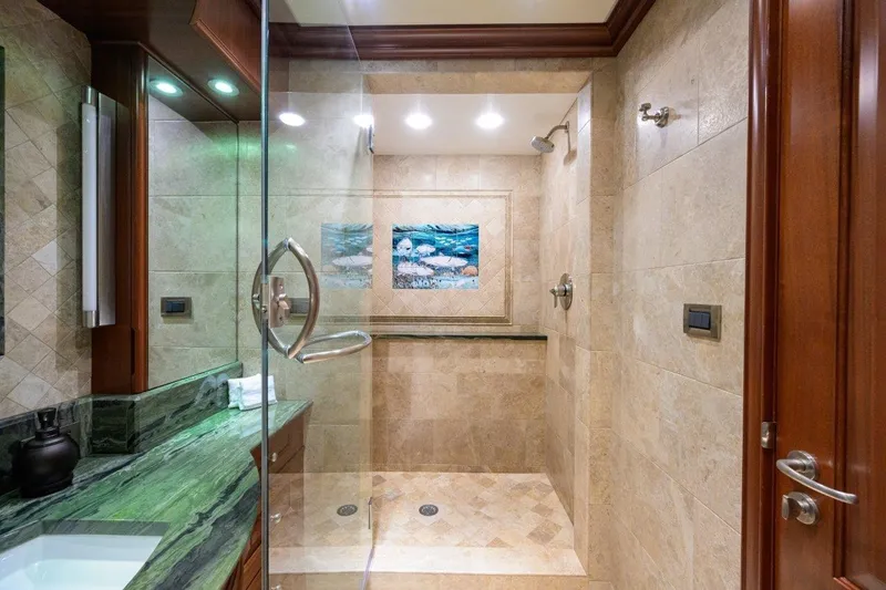 Slide: The Image of Luxurious bathroom on 2011 C & G Boatworks Explorer yacht with elegant marble and wood finishes. - 58