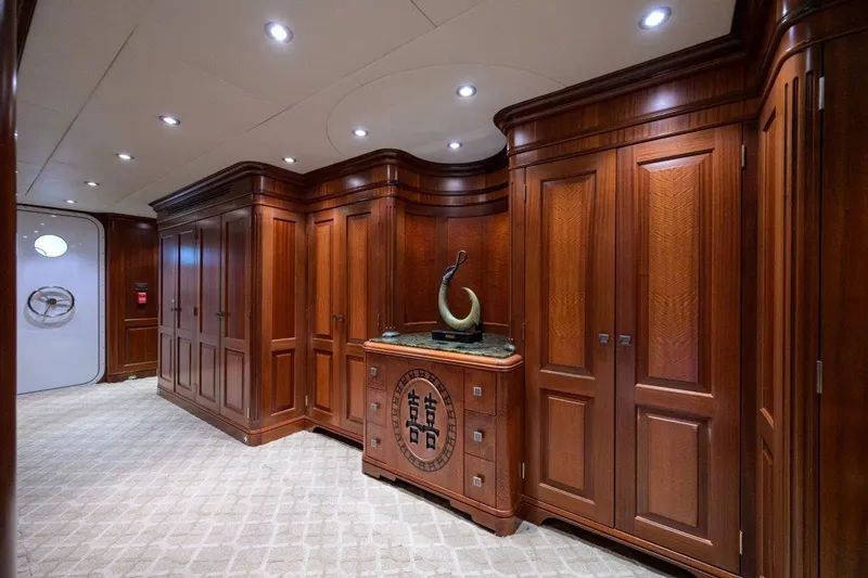Slide: The Image of Luxurious wooden interior of 2011 C & G Boatworks Explorer yacht, featuring elegant cabinetry and sculpture. - 61