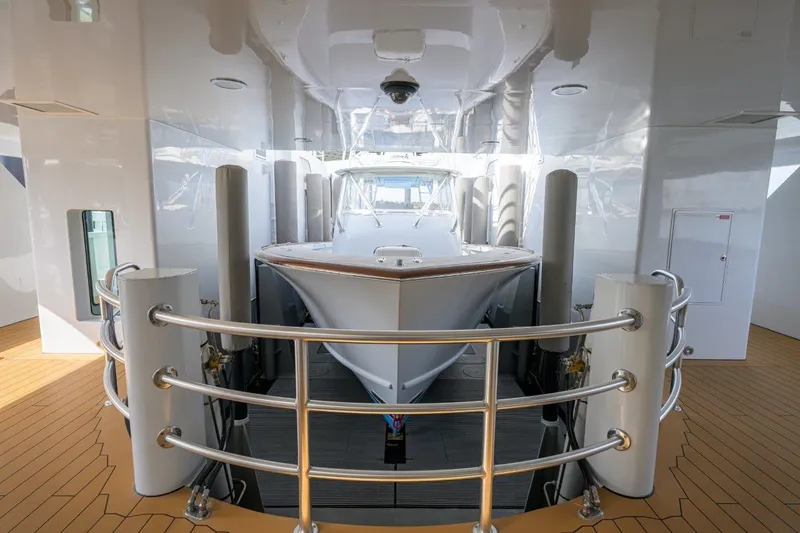 Slide: The Image of 2011 C & G Boatworks Explorer yacht interior with sleek design and polished metal railings. - 7