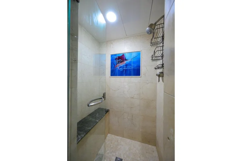 Slide: The Image of Luxurious shower in 2011 C & G Boatworks Explorer yacht, featuring elegant marble tiles. - 73