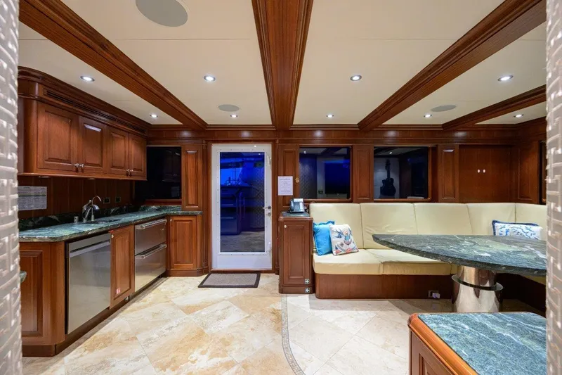 Slide: The Image of Luxurious 2011 C & G Boatworks Explorer yacht interior with elegant wood cabinetry and plush seating. - 75
