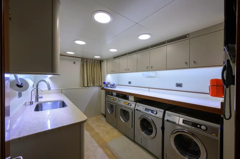 Slide: The Image of Laundry room on 2011 C & G Boatworks Explorer yacht with modern appliances and sleek design. - 79