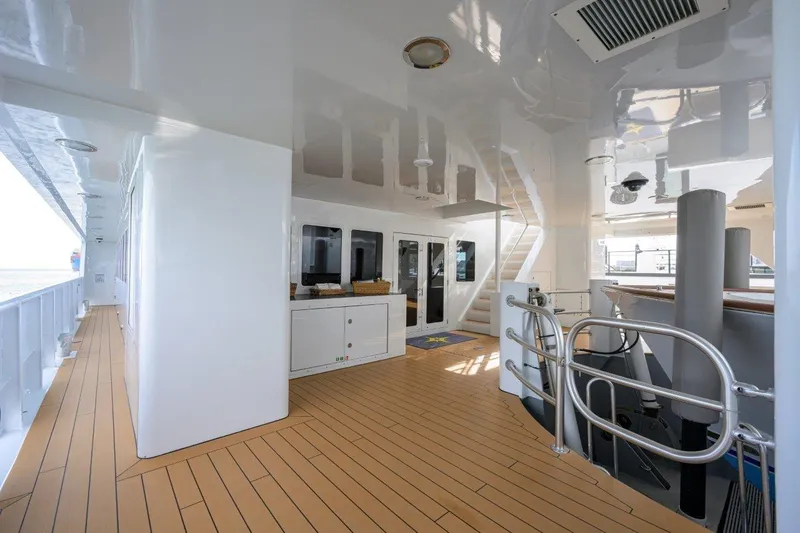 Slide: The Image of Spacious deck of 2011 C & G Boatworks Explorer with modern design and wooden flooring. - 8