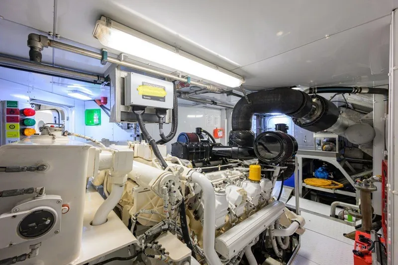 Slide: The Image of Engine room of 2011 C & G Boatworks Explorer, featuring complex machinery and piping. - 85