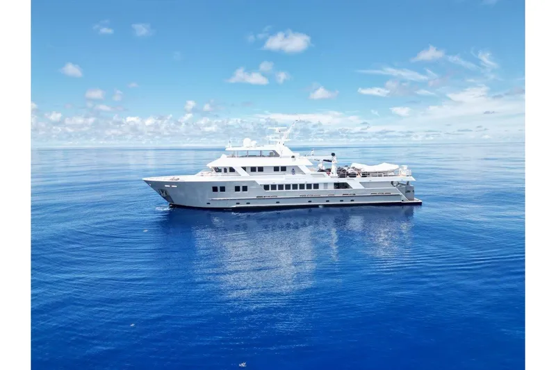 Slide: The Image of Luxurious 2011 C & G Boatworks Explorer yacht on calm ocean waters. - 89