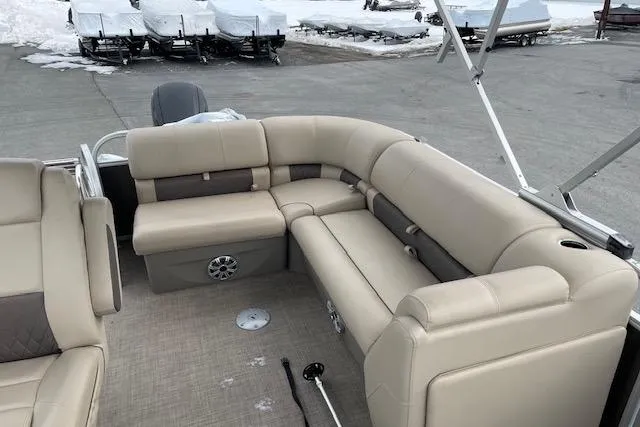 Slide: The Image of 2023 Sun Tracker Party Barge 20 DLX with beige seating and spacious deck layout. - 5