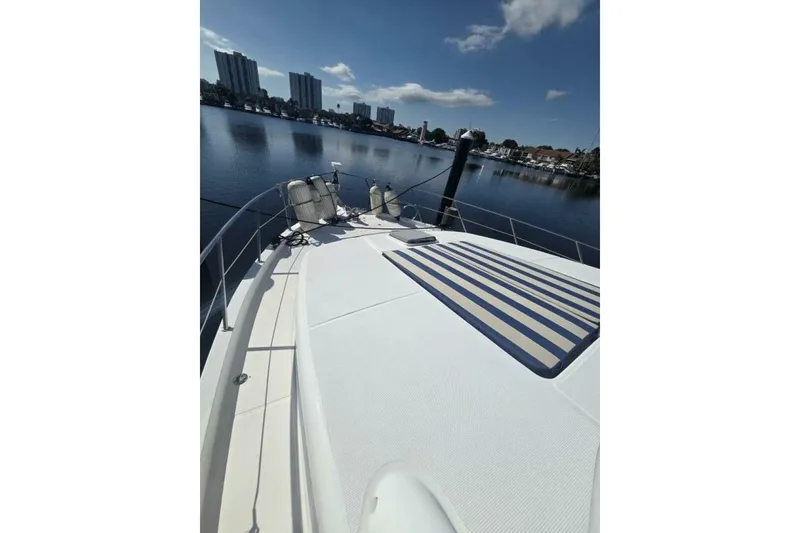 Slide: The Image of 2009 Grand Harbour 66 Motoryacht deck with waterfront cityscape view. - 11