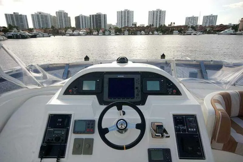 Slide: The Image of Cockpit view of 2009 Grand Harbour 66 Motoryacht with city skyline in background. - 20