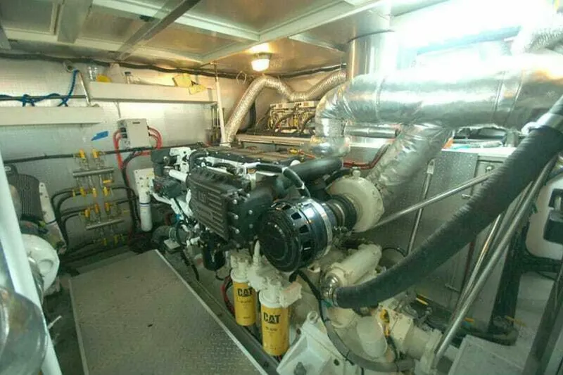 Slide: The Image of Engine room of 2009 Grand Harbour 66 Motoryacht with CAT machinery and complex piping system. - 22