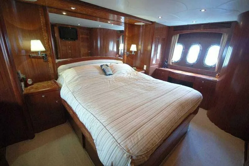 Slide: The Image of Luxurious bedroom in 2009 Grand Harbour 66 Motoryacht with elegant wood paneling. - 26