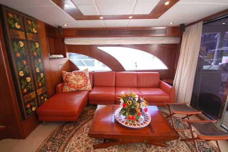 Slide: The Image of Luxurious 2009 Grand Harbour 66 Motoryacht interior with red leather sofa and elegant decor. - 30