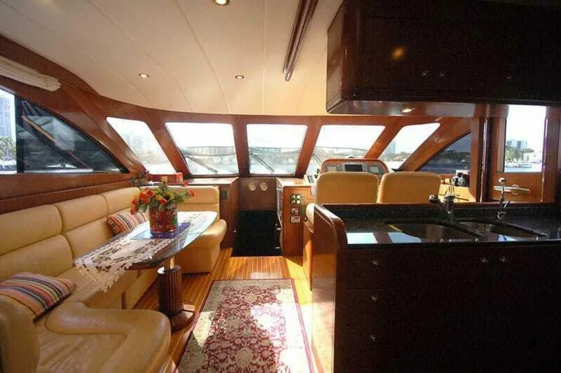 Slide: The Image of Luxurious interior of 2009 Grand Harbour 66 Motoryacht with elegant seating and panoramic windows. - 32