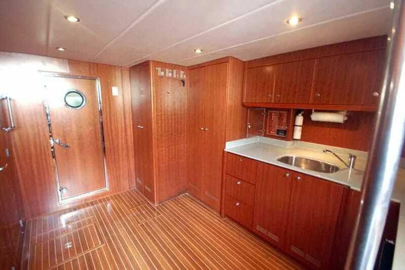 Slide: The Image of Luxurious wood-finished kitchen interior of 2009 Grand Harbour 66 Motoryacht. - 34