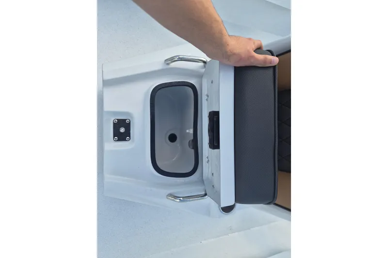 Slide: The Image of 2026 Xpress H24B Bay boat seat storage compartment with hand opening lid. - 11