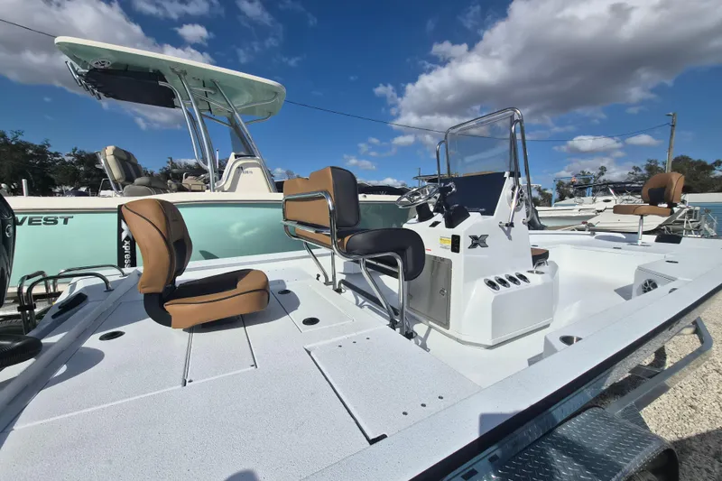 Slide: The Image of 2026 Xpress H24B Bay boat with sleek design and comfortable seating on display. - 3