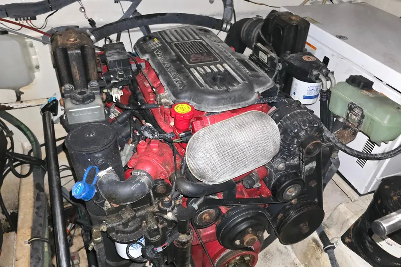 Slide: The Image of Engine compartment of a 2007 Rinker EX 370 boat, featuring a Volvo Penta engine. - 31