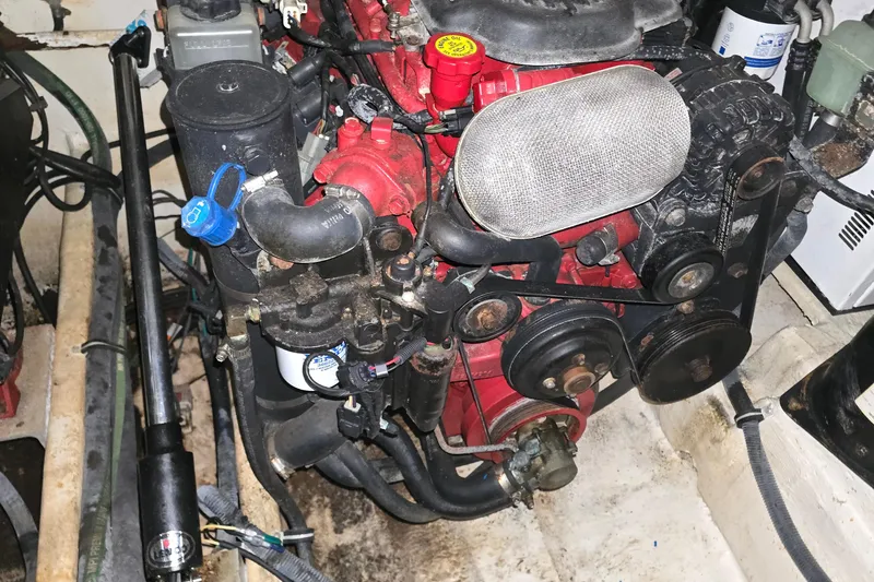 Slide: The Image of Engine compartment of a 2007 Rinker EX 370 boat, showcasing mechanical components. - 32