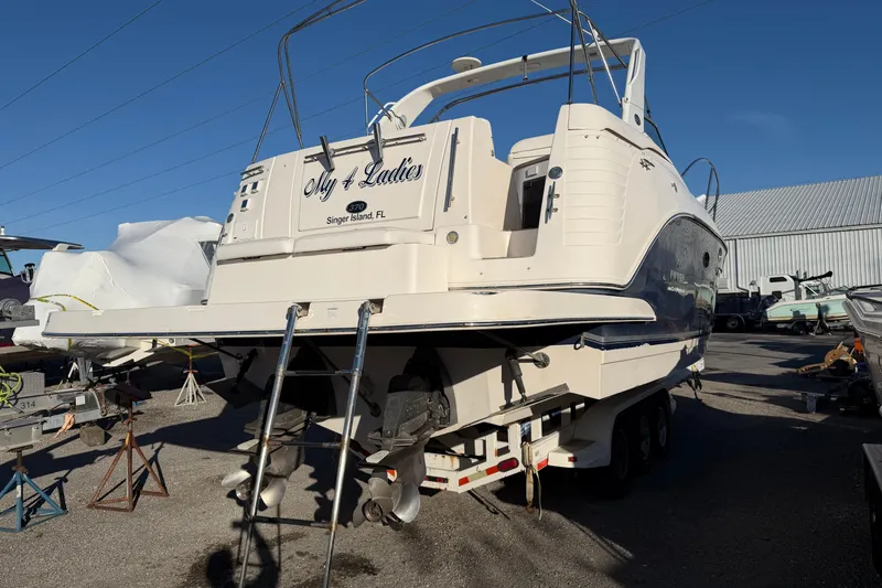 Slide: The Image of 2007 Rinker EX 370 boat on trailer, rear view, sunny day at marina. - 4