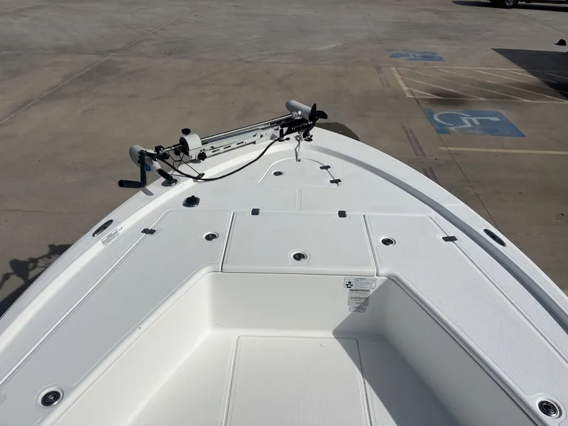 Slide: The Image of Bow deck of a 2014 Mako 21 LTS boat in parking lot. - 12