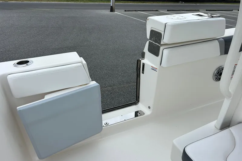 Slide: The Image of 2021 Robalo R272 Center Console boat interior with seating and storage compartments. - 12
