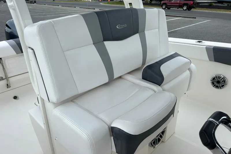 Slide: The Image of 2021 Robalo R272 Center Console boat seating with white and gray upholstery. - 18