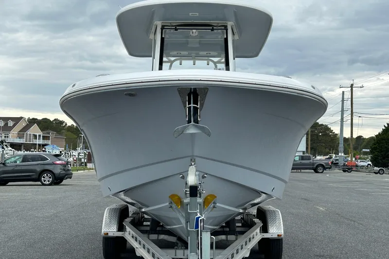 Slide: The Image of 2021 Robalo R272 Center Console boat on trailer in parking lot. - 2