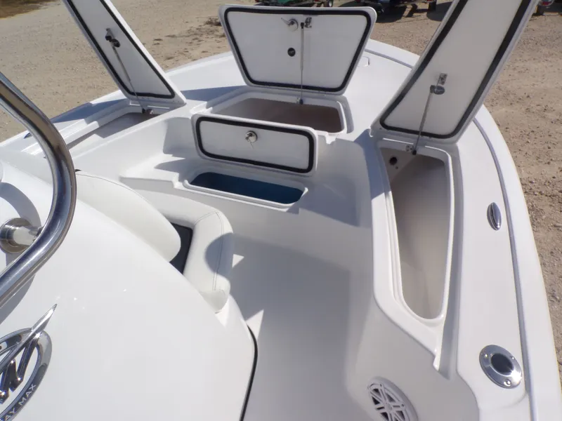 Slide: The Image of Interior view of 2026 Tidewater 2110BMT boat with open storage compartments. - 14