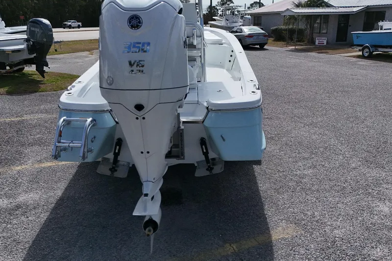 Slide: The Image of 2026 BlackJack 256 Bay boat with Yamaha 350 V6 engine, parked outdoors. - 3