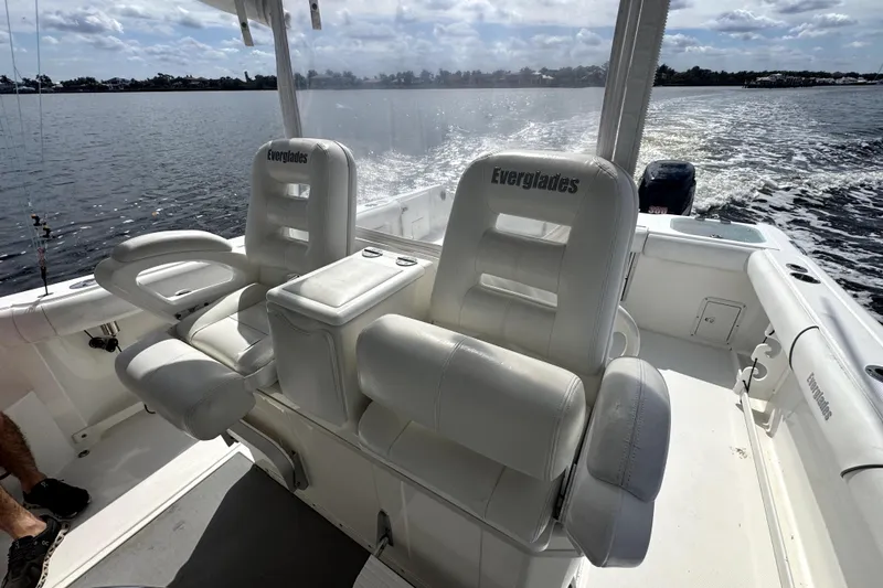 Slide: The Image of 2008 Everglades 350LX boat interior with white seating on a sunny day. - 7