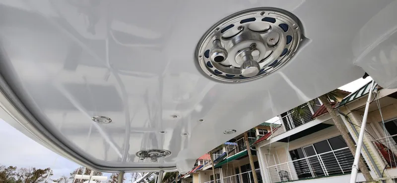 Slide: The Image of Underside view of a 1995 Cabo 35 Express boat with circular fixtures. - 56